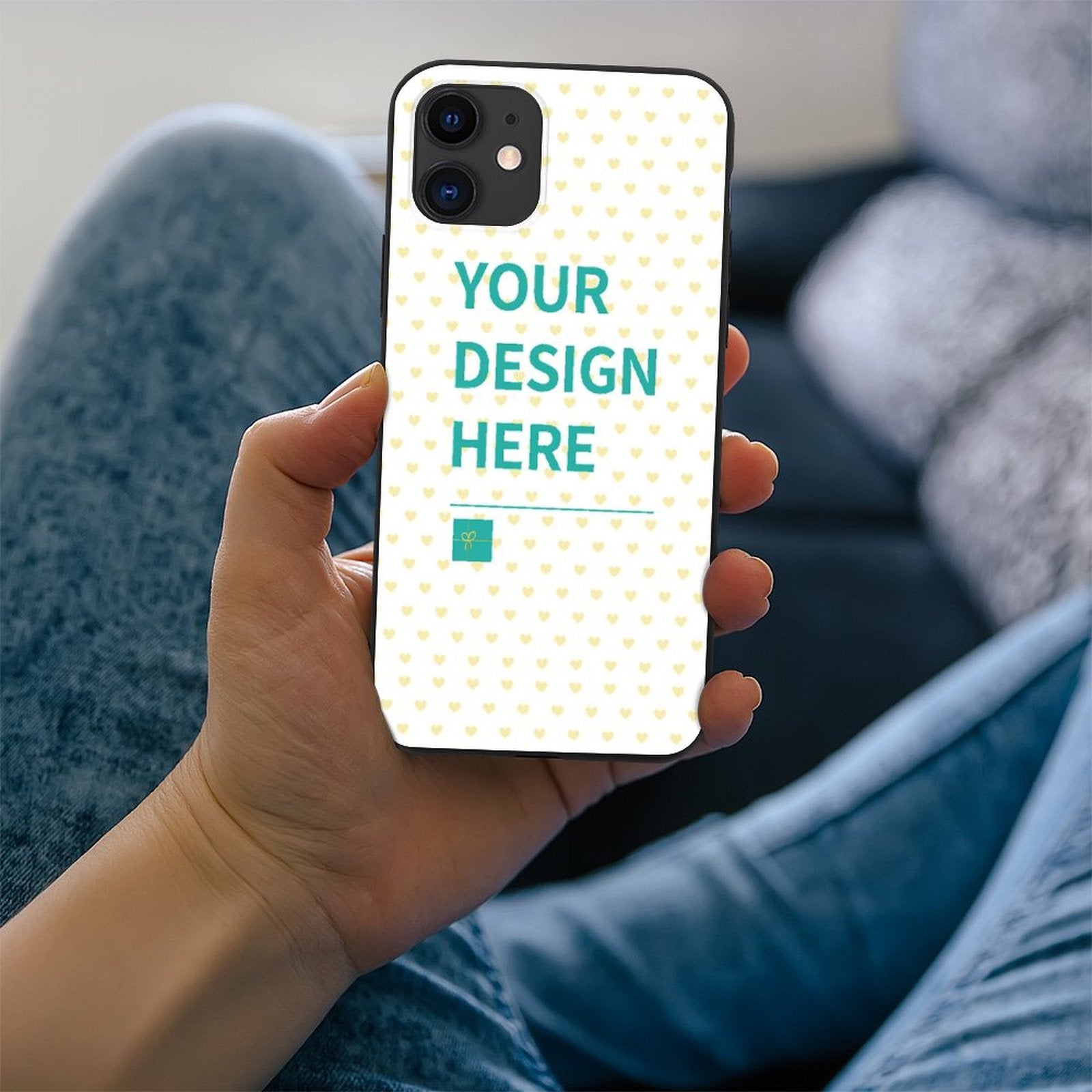 Custom iPhone 11 case featuring "YOUR DESIGN HERE" text with a heart pattern, MyArtsyGift.com