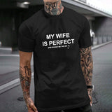 Black cotton t-shirt with 'MY WIFE IS PERFECT' text, Gildan unisex tee for husbands. MyArtsyGift.com