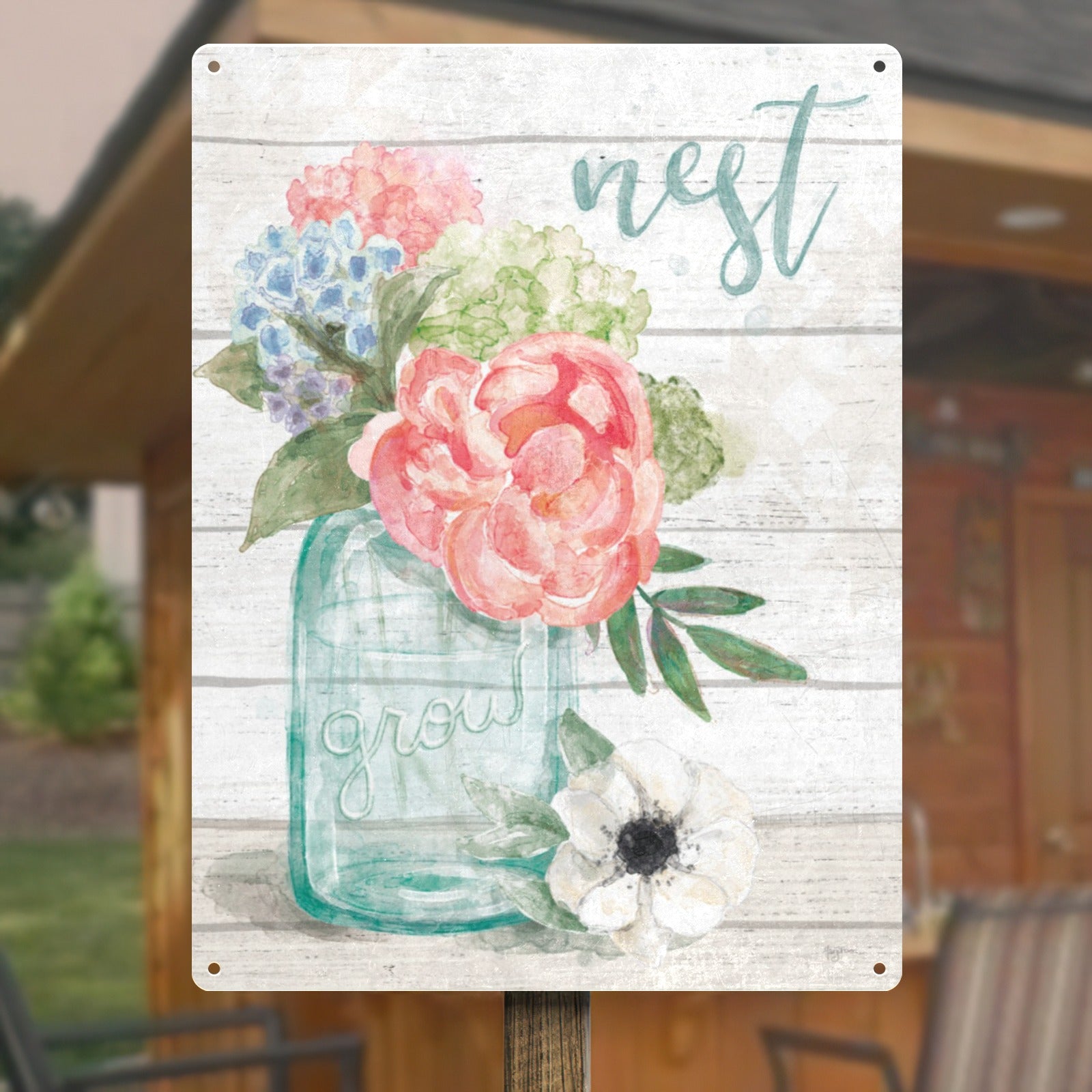 Floral metal sign with pastel peonies, hydrangeas, and 'nest grow' text; home decor.