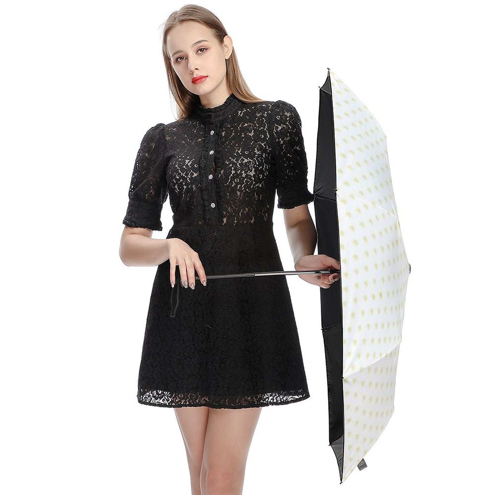 Woman with black dress holding a white and yellow dot pattern custom 3-fold umbrella, UV resistant.