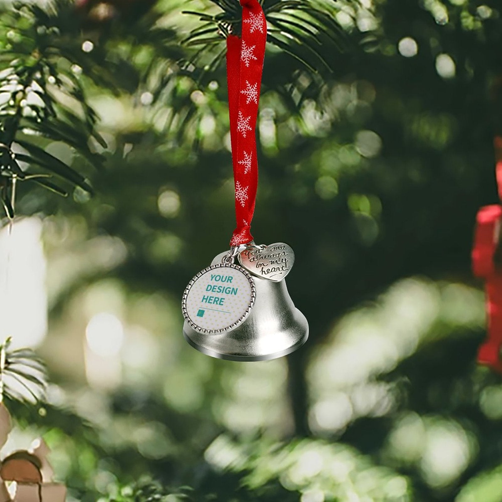 Customizable Christmas jingle bell with Your Design Here, hanging from red snowflake ribbon, perfect Christmas tree decor