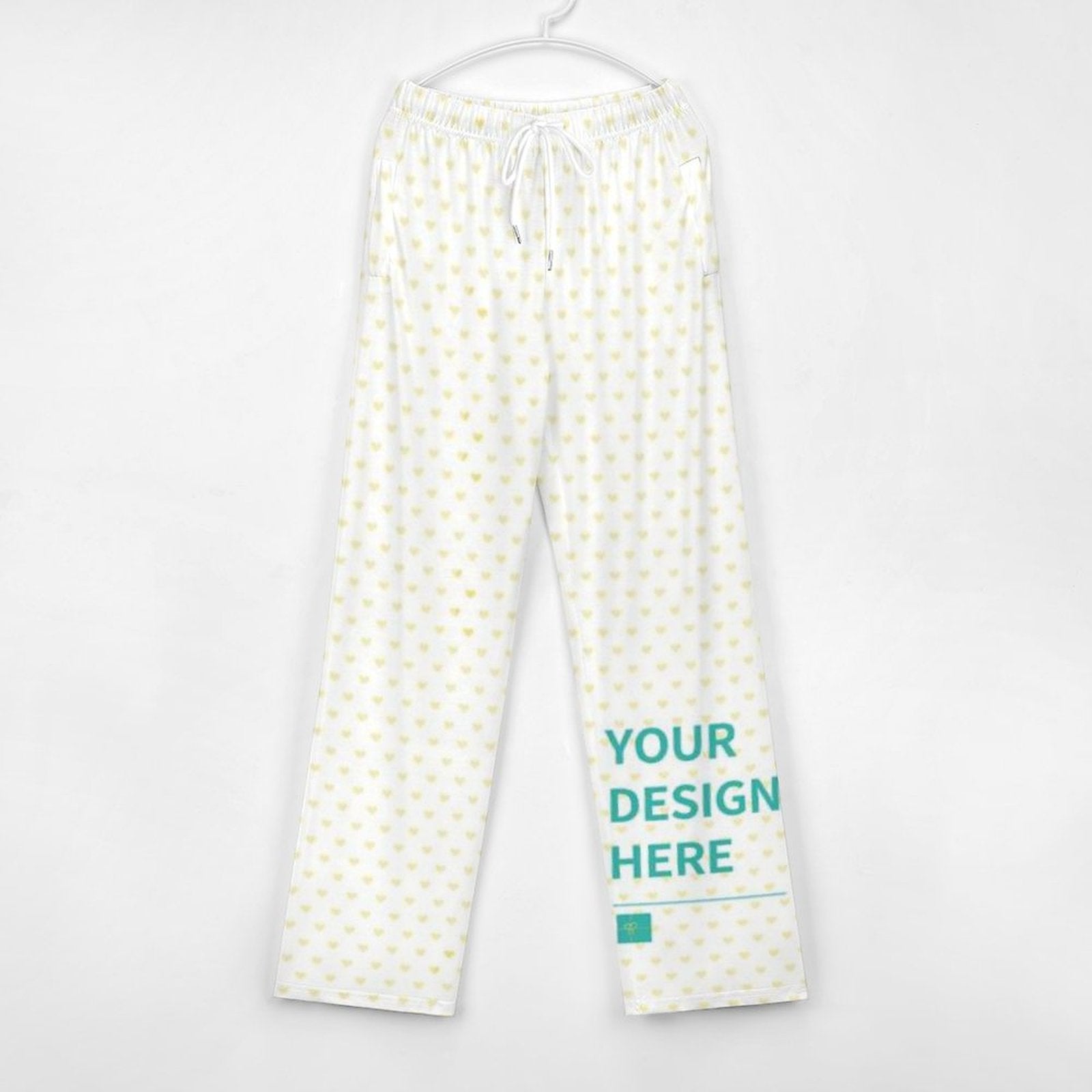 Custom pajama pants with white hearts, personalized sleepwear with 'YOUR DESIGN HERE' at MyArtsyGift