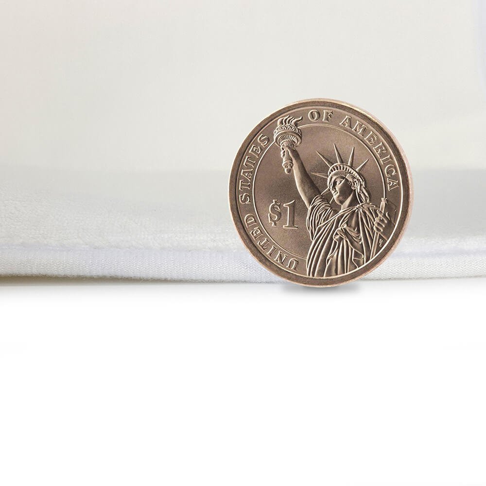 One-dollar coin on white coral fleece fabric - detail of bathroom rug material from MyArtsyGift