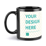 Personalized black ceramic mug with custom design, perfect for gifts or personal use. Features 'YOUR DESIGN HERE' text.