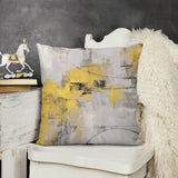 Abstract throw pillow cover with yellow, gray, and black brushstroke design. Soft plush material for couch or sofa.