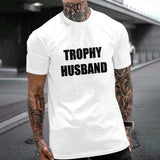 White Gildan Unisex TROPHY HUSBAND T-shirt, perfect gift for husband. Cotton fabric, comfortable fit.