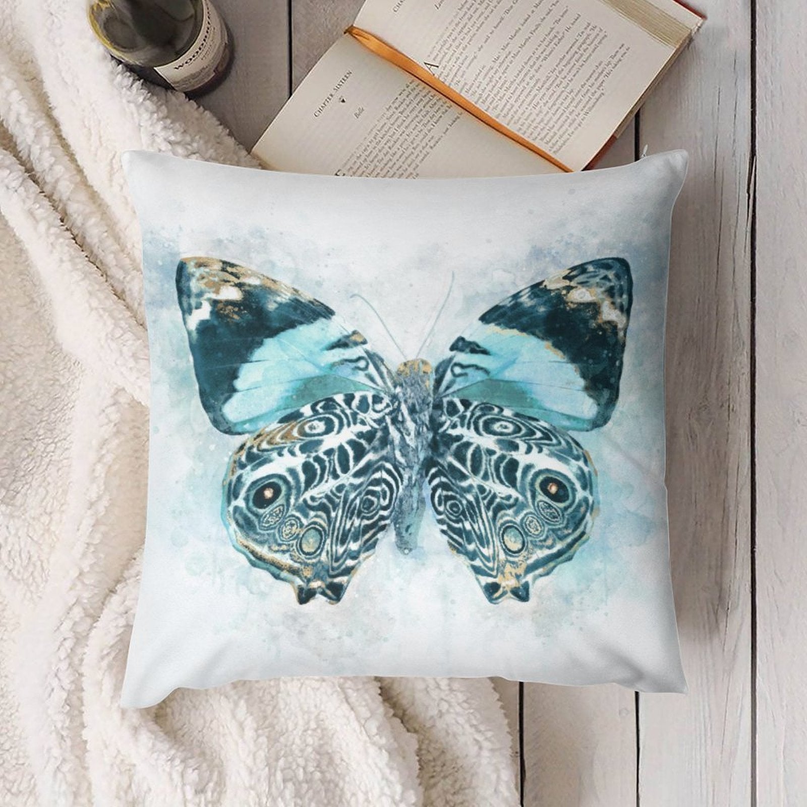 Plush throw pillow cover with a teal and gold butterfly design for sofa decor.