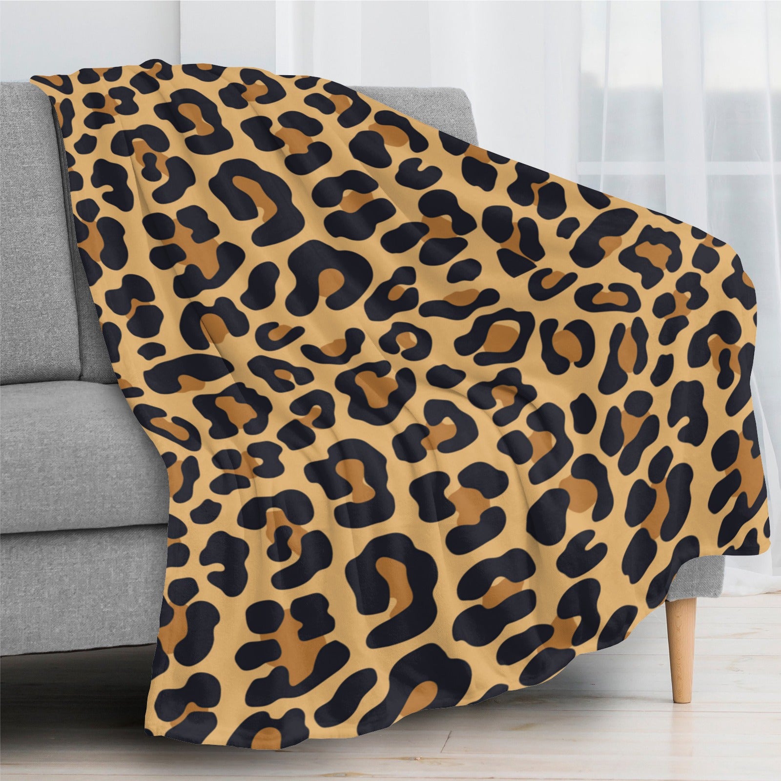 Leopard print flannel blanket, soft and cozy, perfect for home decor.