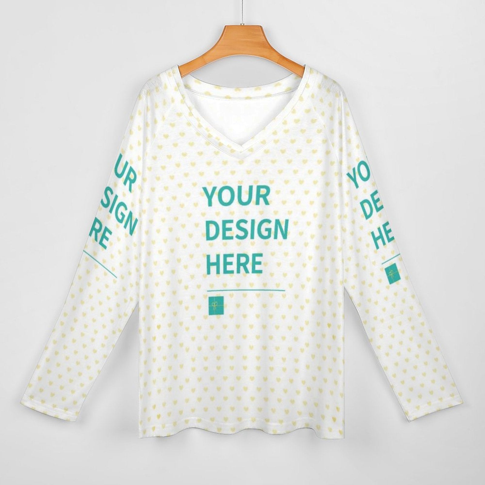 Customizable women's V-neck long sleeve tee. White shirt with heart pattern. Design your own shirt at MyArtsyGift