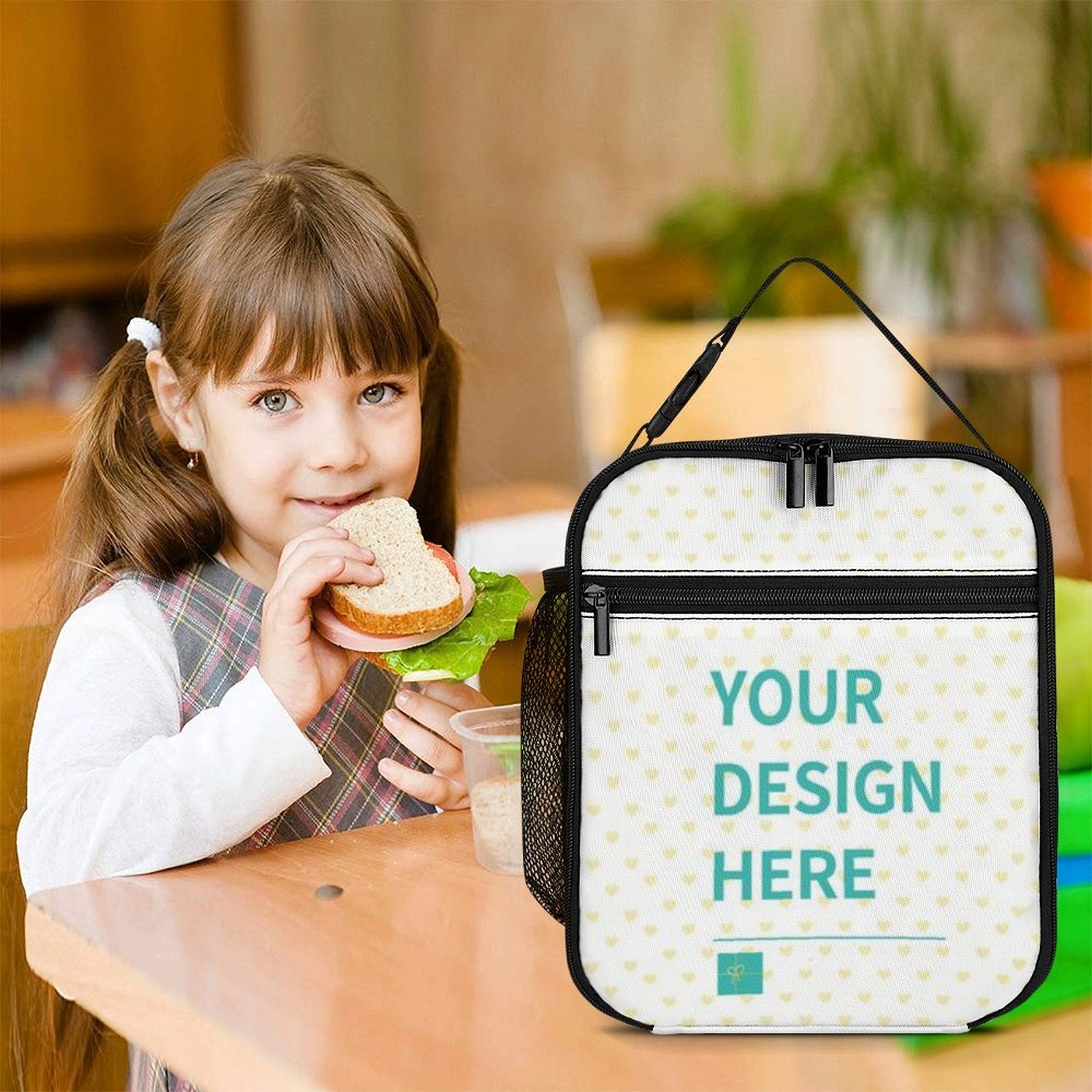Customizable lunch box tote bag with 'YOUR DESIGN HERE' design, perfect for work, picnic or travel, held by a girl