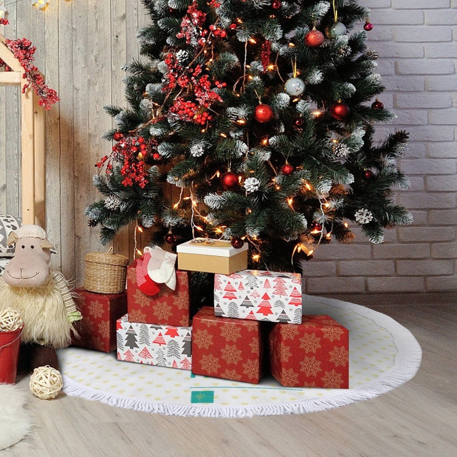 Custom Christmas tree skirt with heart pattern, fringe, and gifts under a decorated tree. Festive Xmas decoration.