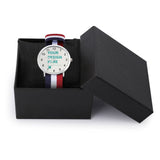 Customizable photo watch with nylon strap, featuring your design, navy blue, red, and white striped strap, in gift box.
