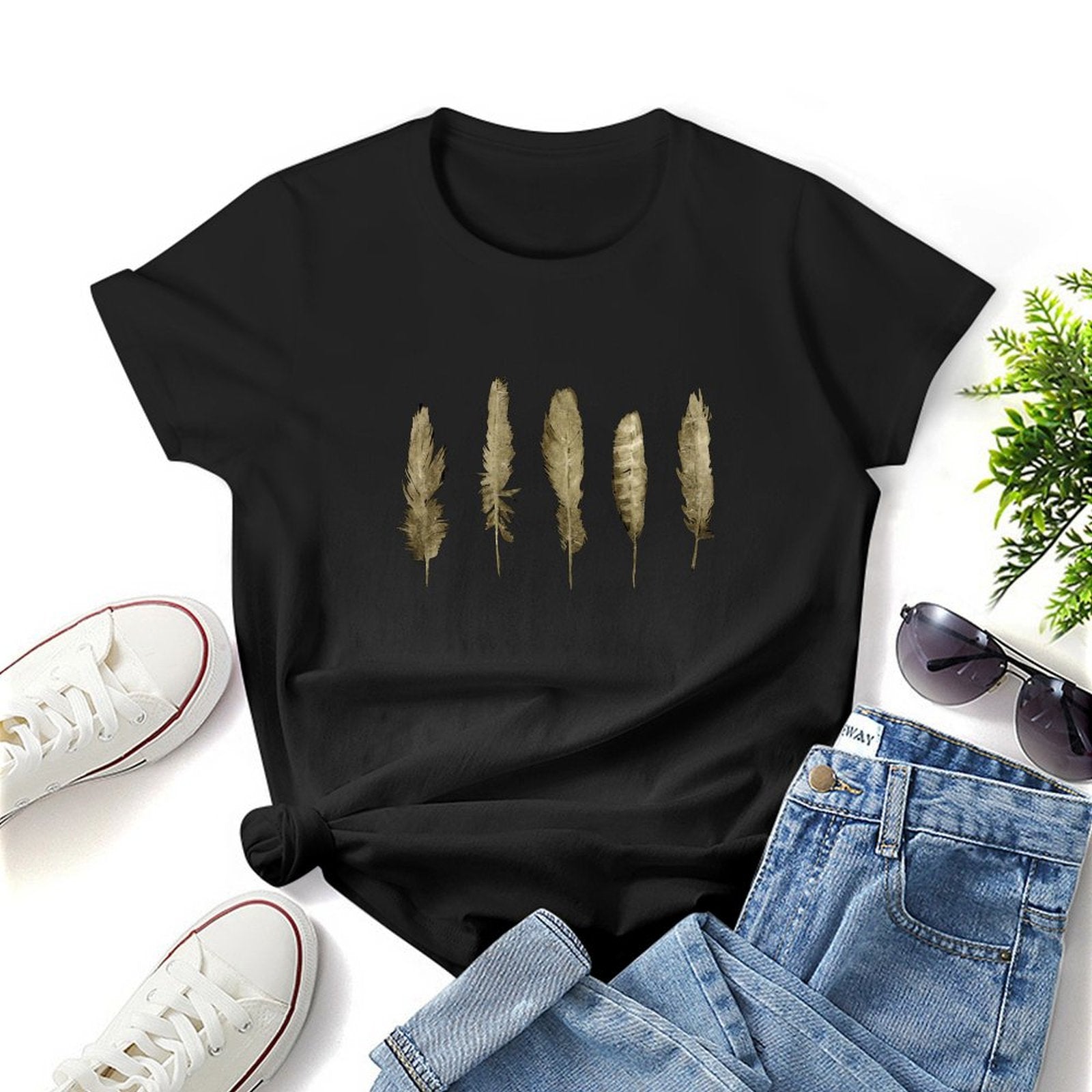 Black women's t-shirt with golden feather graphic print, casual style.