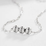 Silver custom name necklace with three engraved bead pendants, personalized jewelry gift for men and women.