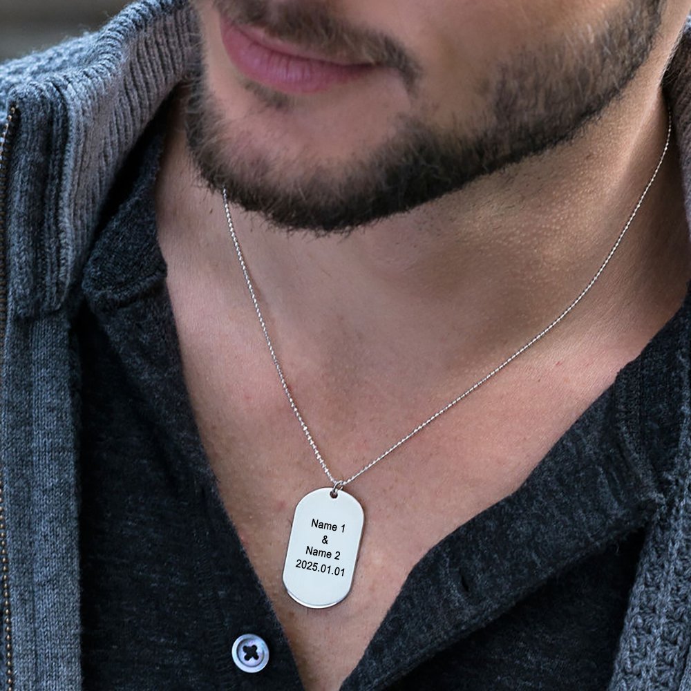 Personalized silver dog tag necklace for men, engraved with custom text, perfect gift.