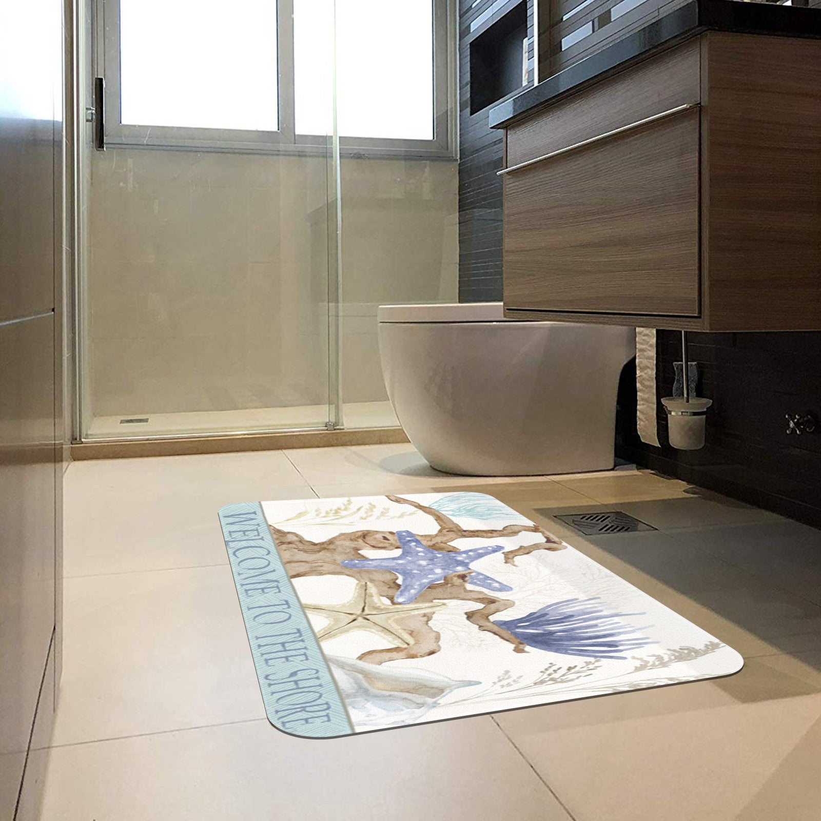 Beach-themed doormat with "WELCOME TO THE SHORE" text, for bathroom entrance.