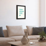 Custom canvas print with 'YOUR DESIGN HERE' text in a black frame, personalized wall art for home decor