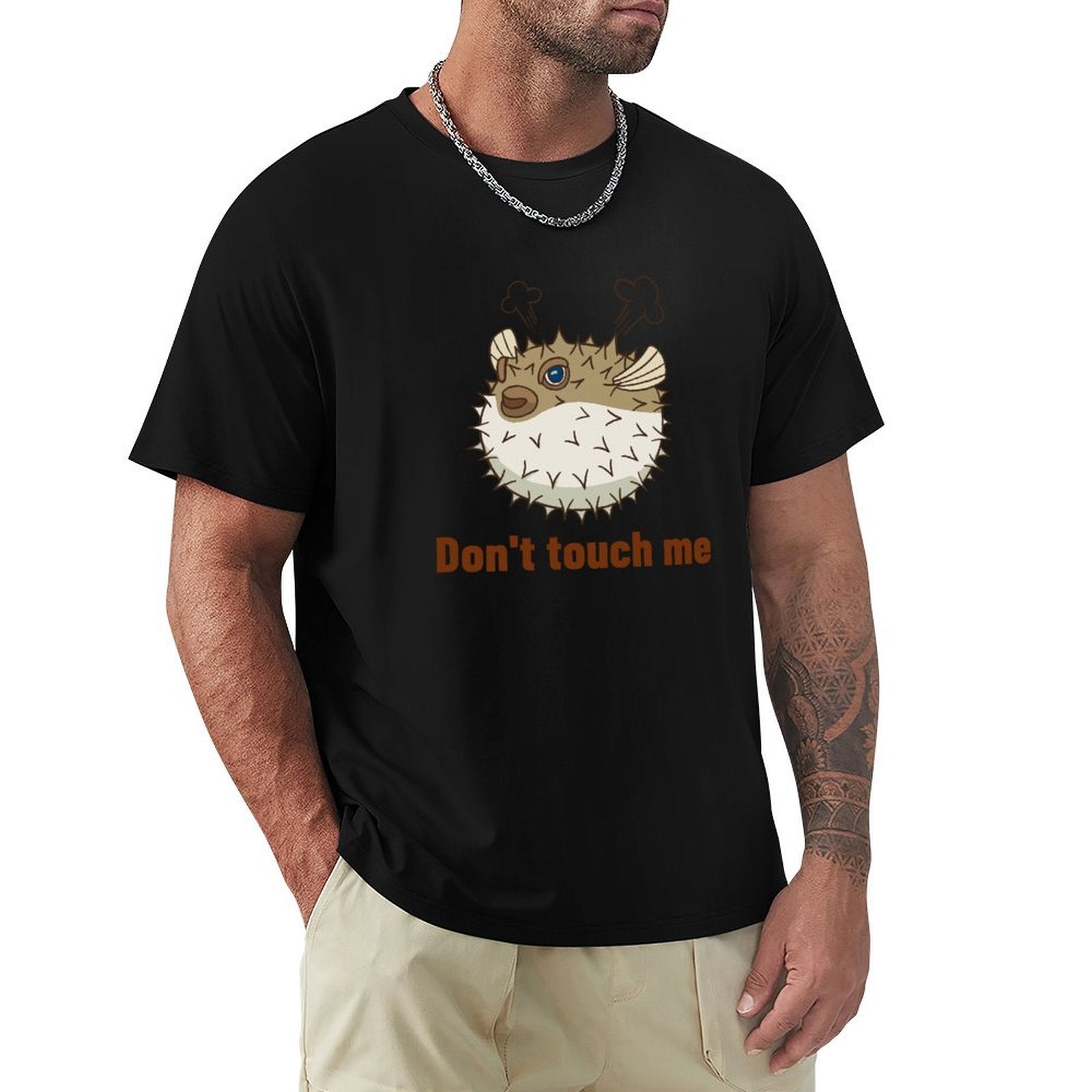 Black men's short sleeve crew neck t-shirt featuring a pufferfish design and the text "Don't touch me".