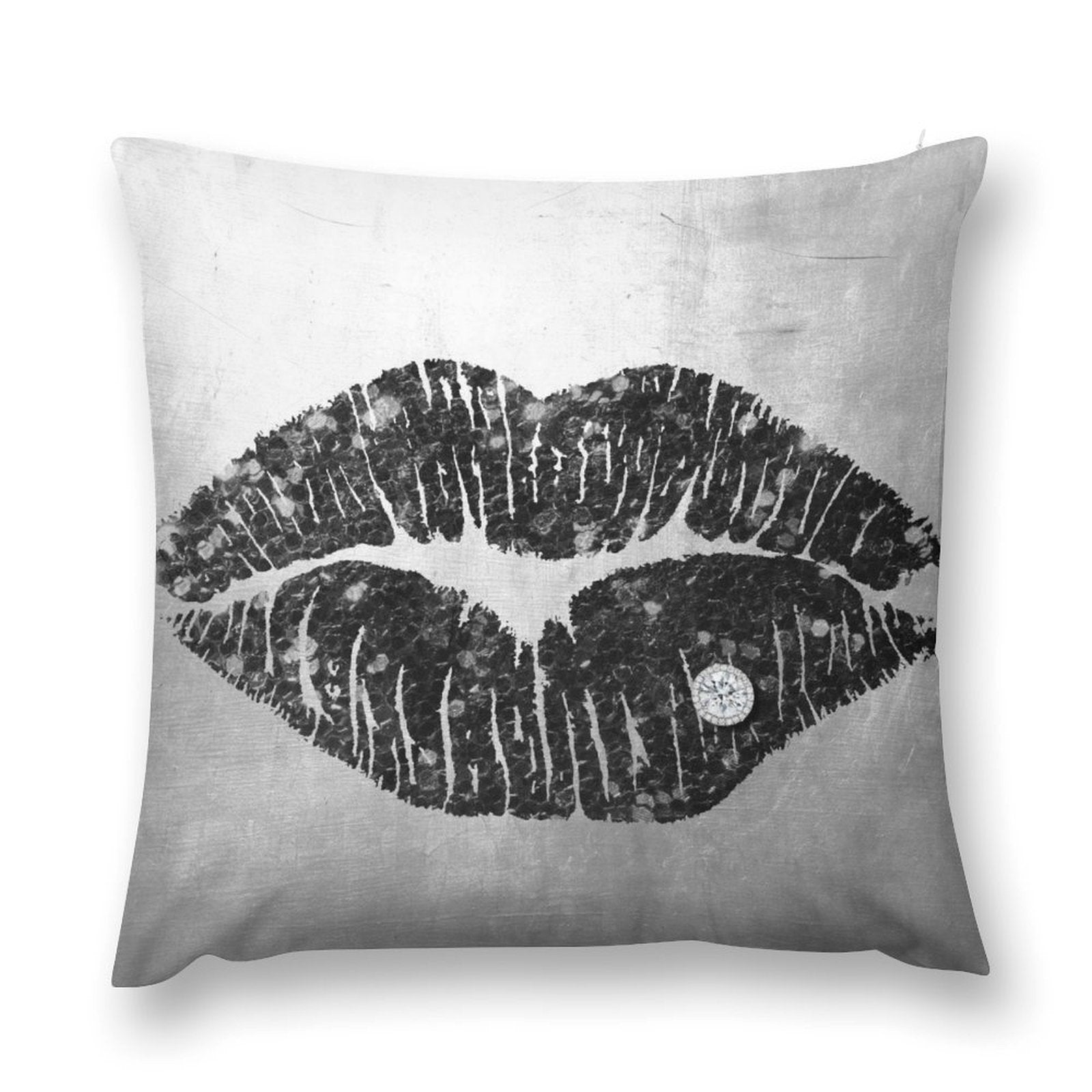 Black lip print pillow cover with diamond accent on a grey background.