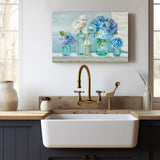 Canvas print of blue hydrangeas and white roses in glass jars, perfect kitchen wall decor. Made in USA.