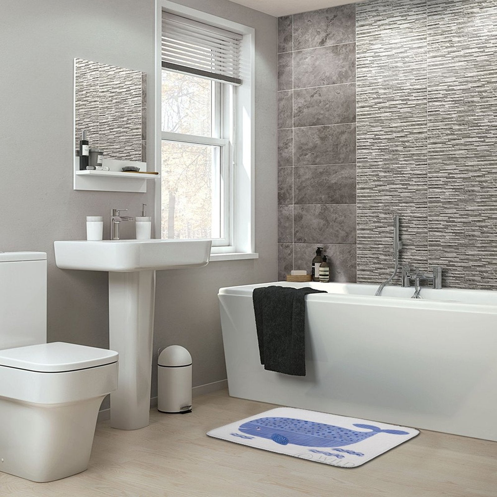 Coral velvet bath rug with blue whale design in a modern bathroom, non-slip floor carpet