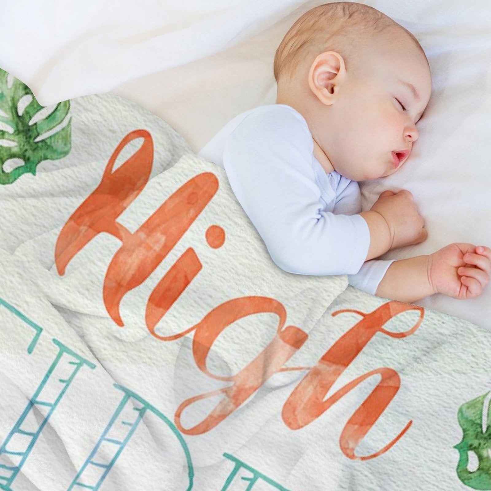Cozy fleece blanket with "High" text and baby sleeping, perfect for bed or travel