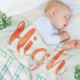 Cozy fleece blanket with "High" text and baby sleeping, perfect for bed or travel