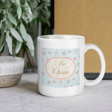 White ceramic Ma Chérie coffee mug with floral spring design, perfect gift for any occasion, made in USA.