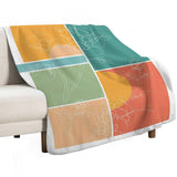 Lamb wool fleece blanket, floral design in orange, green, peach colors, for bed and sofa, "WILD" text