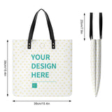 Customizable PU leather tote bag with "YOUR DESIGN HERE" message and heart pattern, perfect for shopping and work