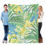 Green tropical plants flannel blanket for sofa couch bed. Features vibrant floral design made in USA