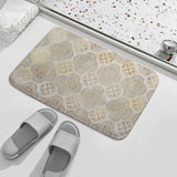 Non-slip bathroom rug with a gold floral pattern and a light gray color scheme, complementing the bathroom decor.