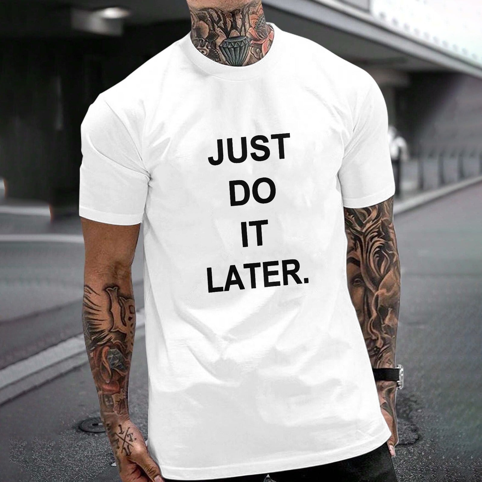 White cotton JUST DO IT LATER unisex t-shirt, Gildan, for fitness and leisure, featuring a man with tattoos.