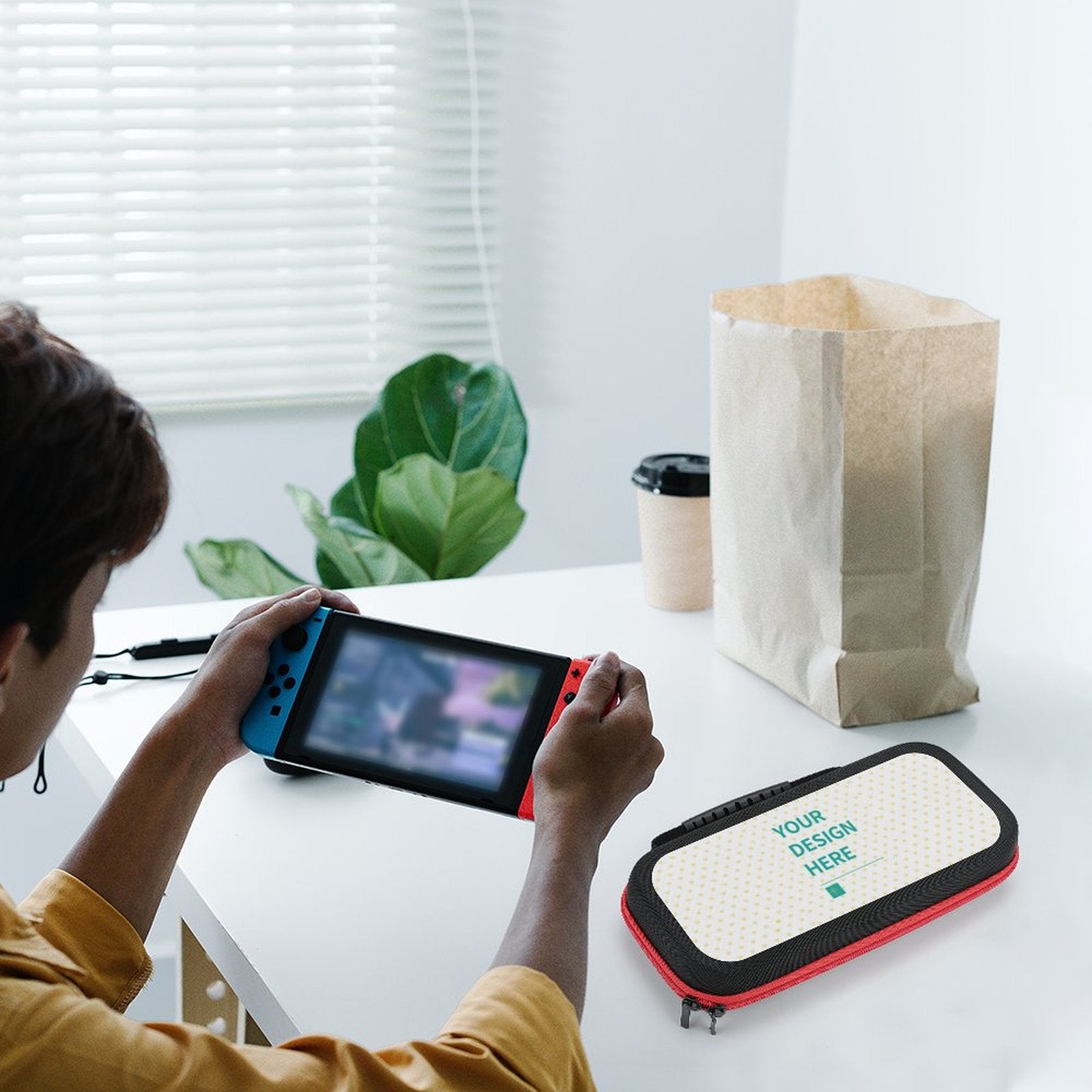 Custom Switch carrying case with design area and text, black with red trim, near console