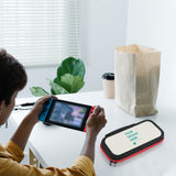 Custom Switch carrying case with design area and text, black with red trim, near console