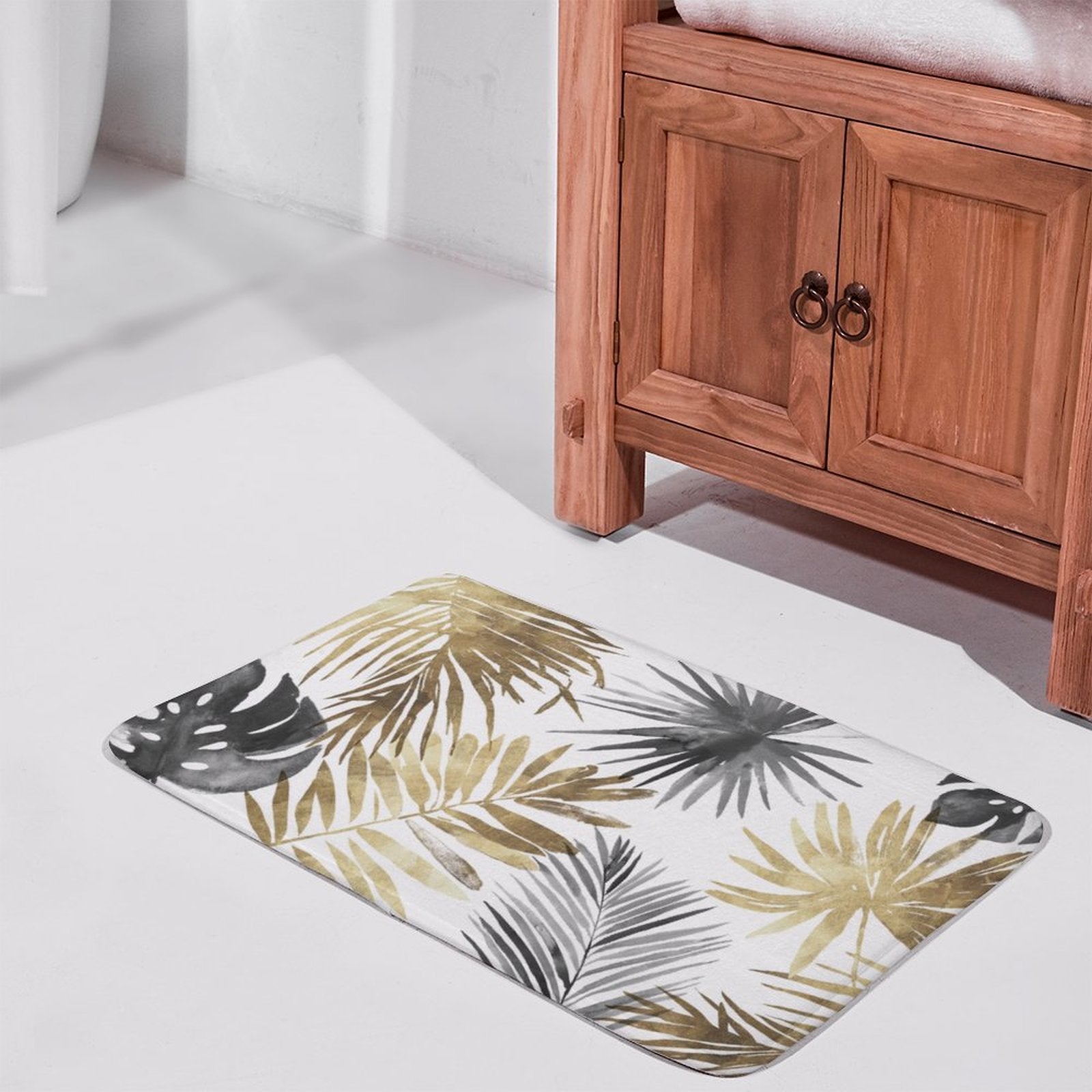 Coral velvet bath rug with gold, gray and black tropical leaves for bathroom or kitchen