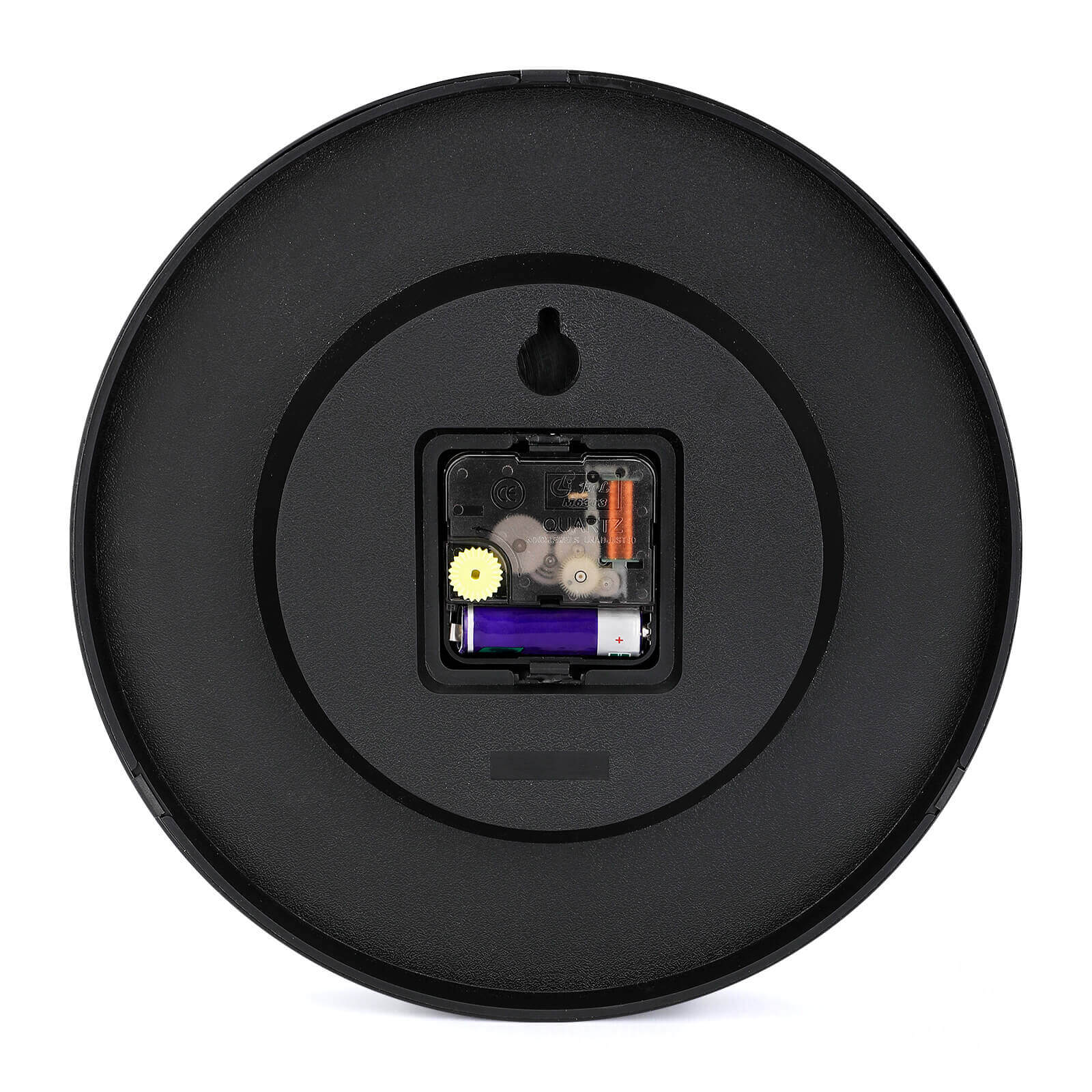 Black round wall clock back showing quartz movement and battery slot for a quiet home decor clock, "QUARTZ" detail.