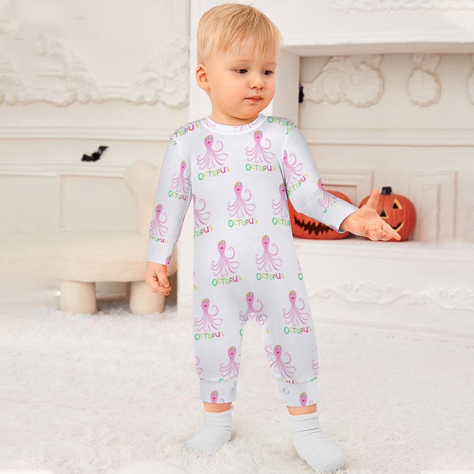 Newborn baby in white octopus print romper. Soft cotton jumpsuit from MyArtsyGift.