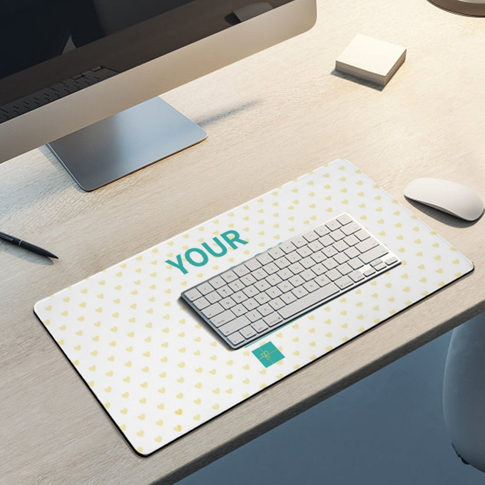 Personalized desk mat with heart pattern, keyboard, mouse, monitor. Customizable office desk mat.