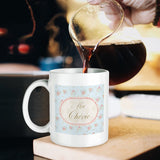 White ceramic Ma Chérie mug with floral design being filled with coffee, perfect for gifting.