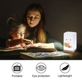 Table lamp with tiger design, night light, 'BE BRAVE' text, for bedroom, used by a mother and child while reading.