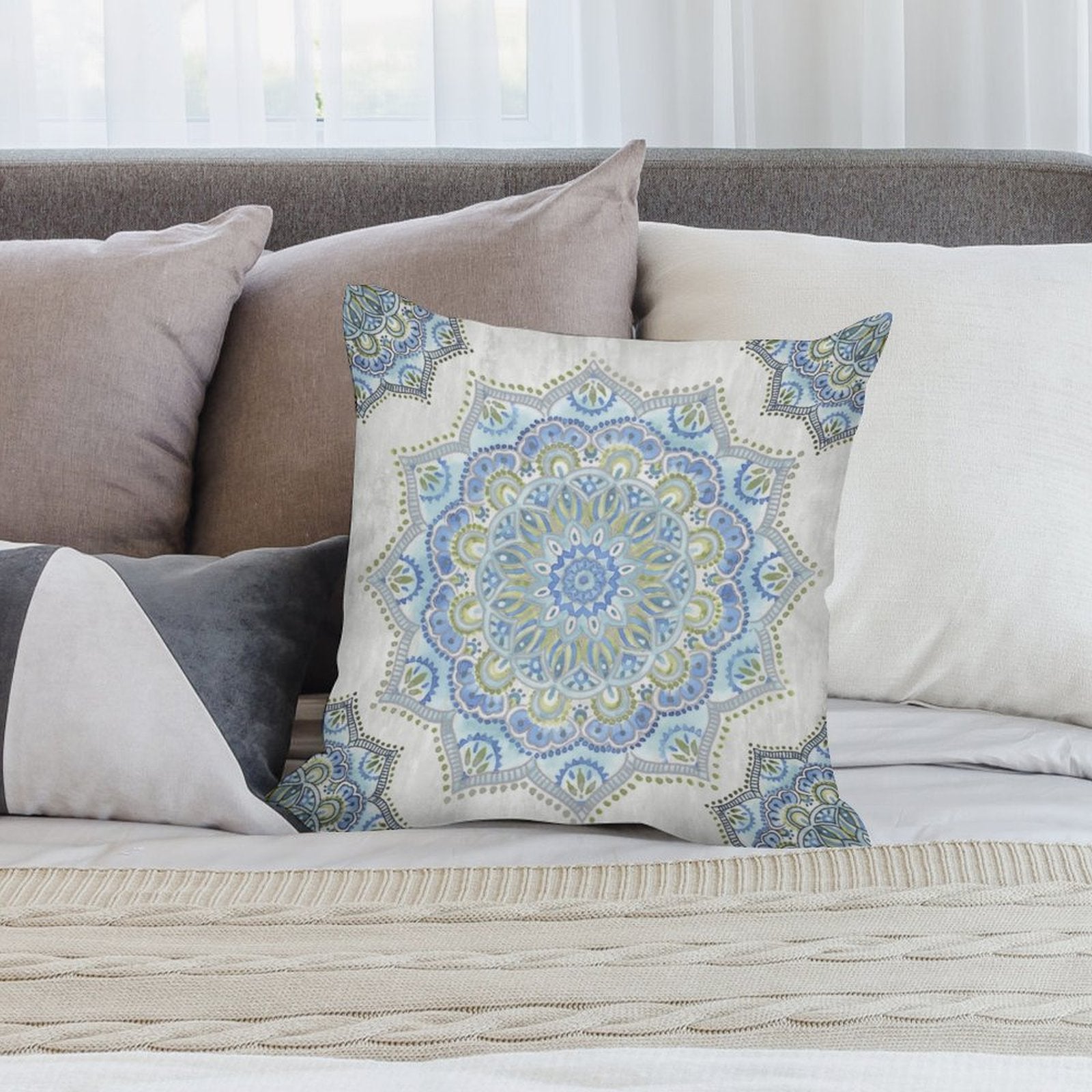 Blue and green mandala plush throw pillow cover on bed, soft decorative pillow for sofa, living room decor, and home design.