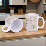 White ceramic mug with Wild Apple wildflower design, perfect for home or office, made in USA.