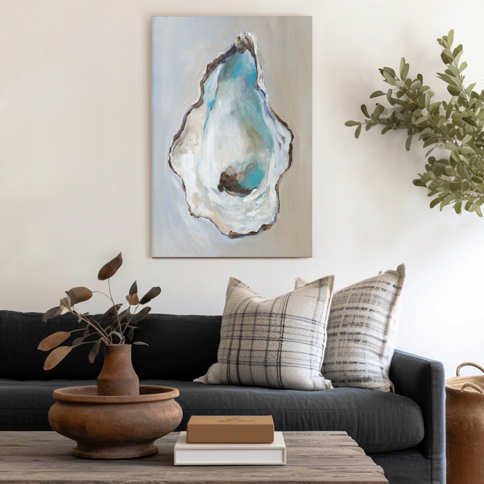 Oyster wall art canvas print in a modern living room setting. Home decor featuring blue oyster shell design.