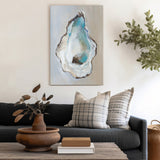 Oyster wall art canvas print in a modern living room setting. Home decor featuring blue oyster shell design.