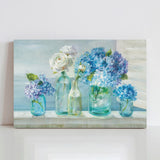 Canvas print of hydrangeas and white roses in glass jars, perfect wall decor for living rooms.