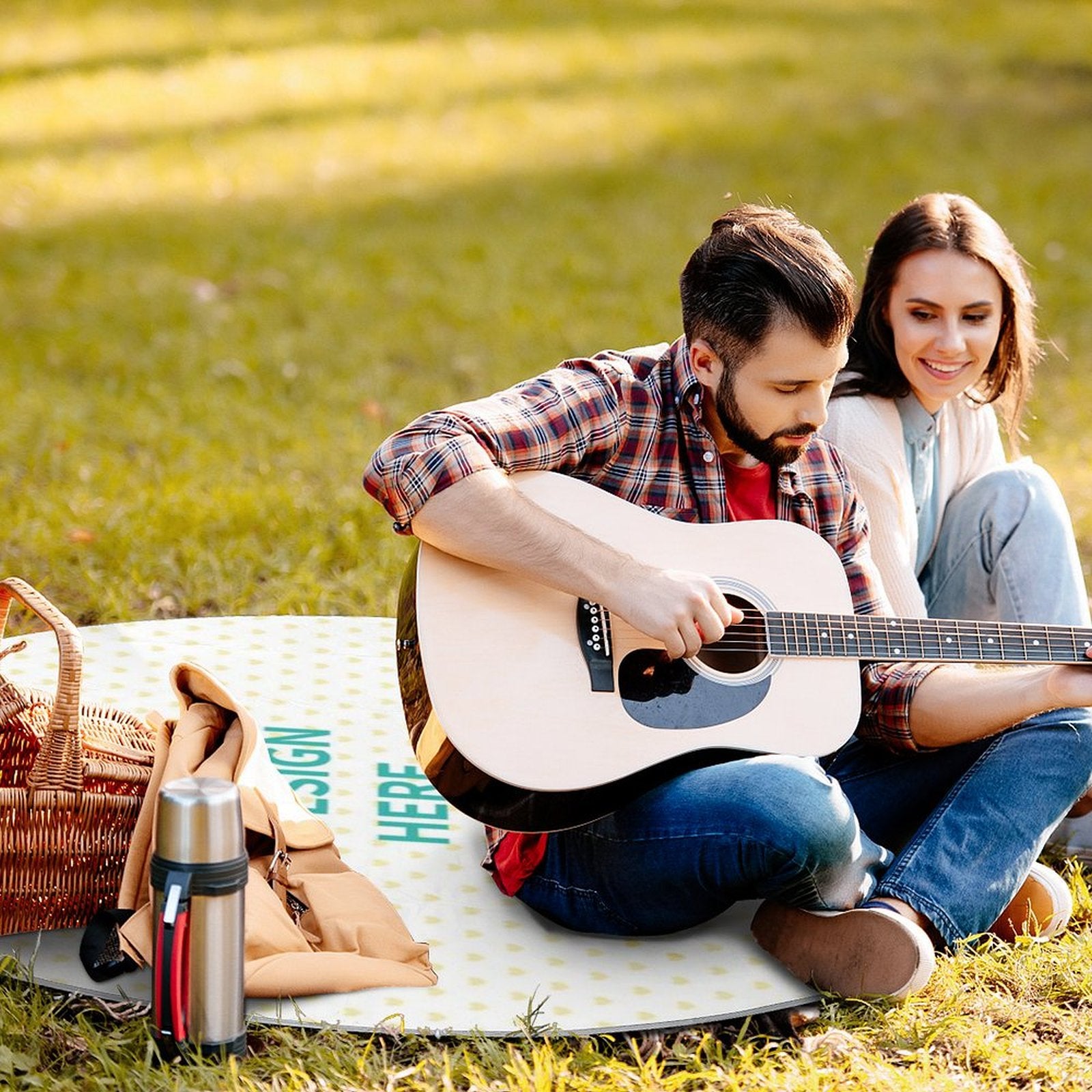 Picnic with guitar on a waterproof, foldable picnic mat; perfect for outdoor use, family picnic.