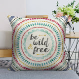 Linen pillow case with 'be wild & free' text and mandala design for living room decor.