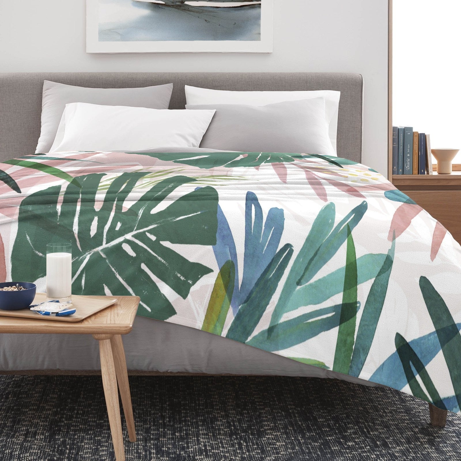 Tropical Plants Flannel Blanket on bed with watercolor design, green leaves, USA made home decor