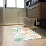 Watercolor floral doormat in bathroom. Soft rubber mat with floral design, for indoor/outdoor use.